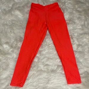 Neon orange, scrunch butt leggings.